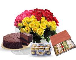 Mix Roses, chocolate, sweets with chocolate Cake